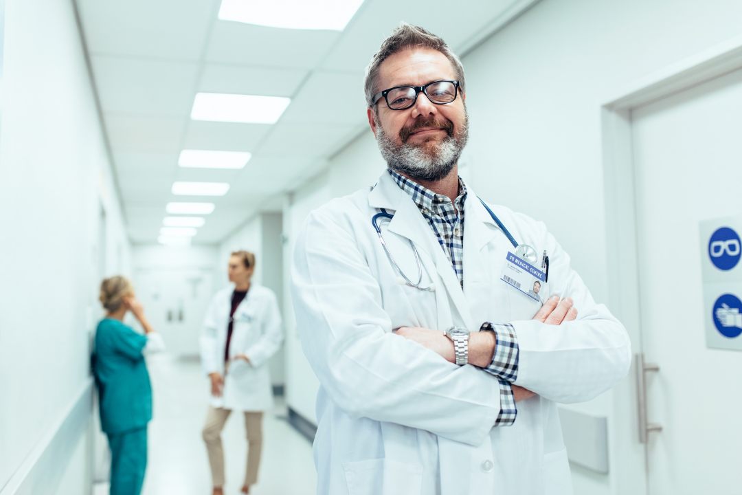A physician in a medical practice corridor
