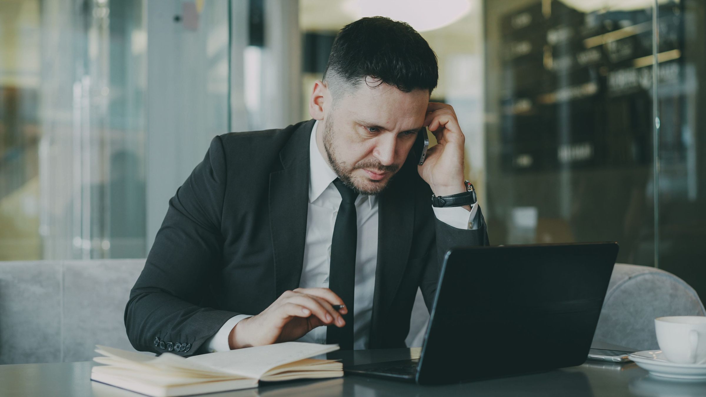 An owner taking a call from the office