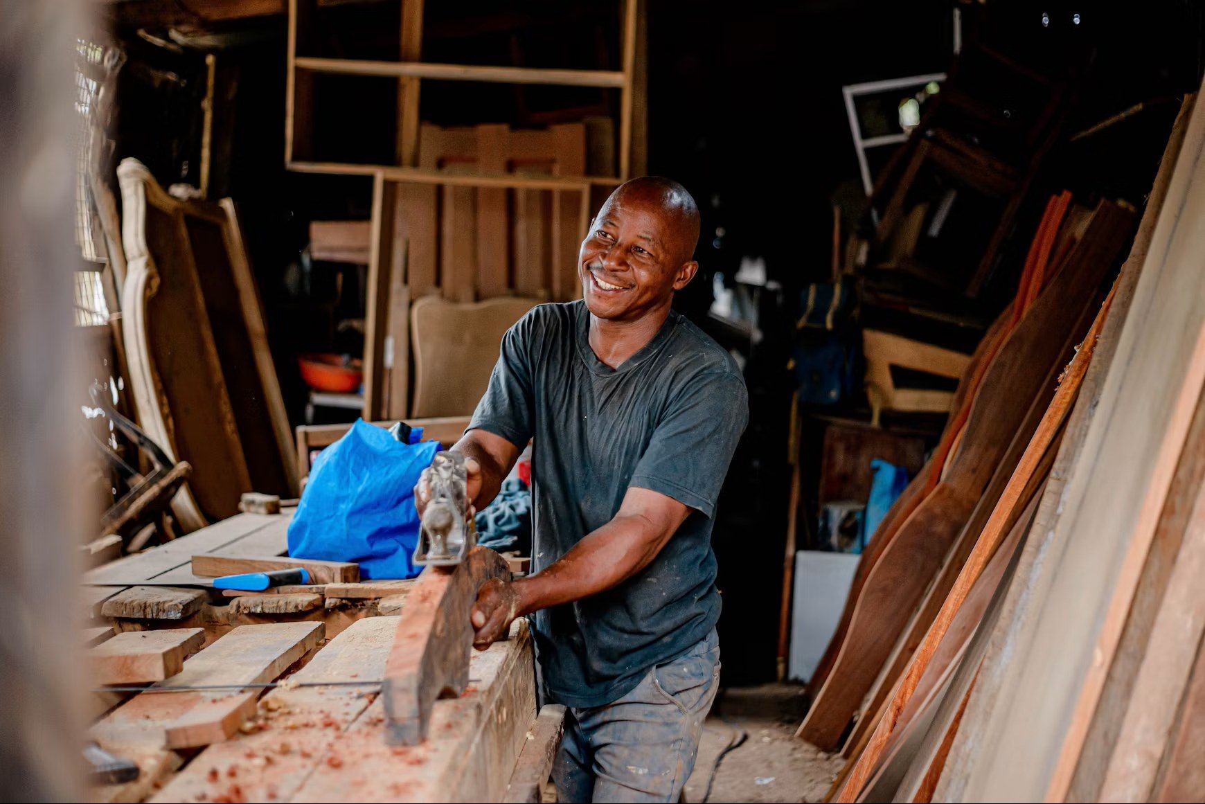 Owner at the table saw in his woodworking shop